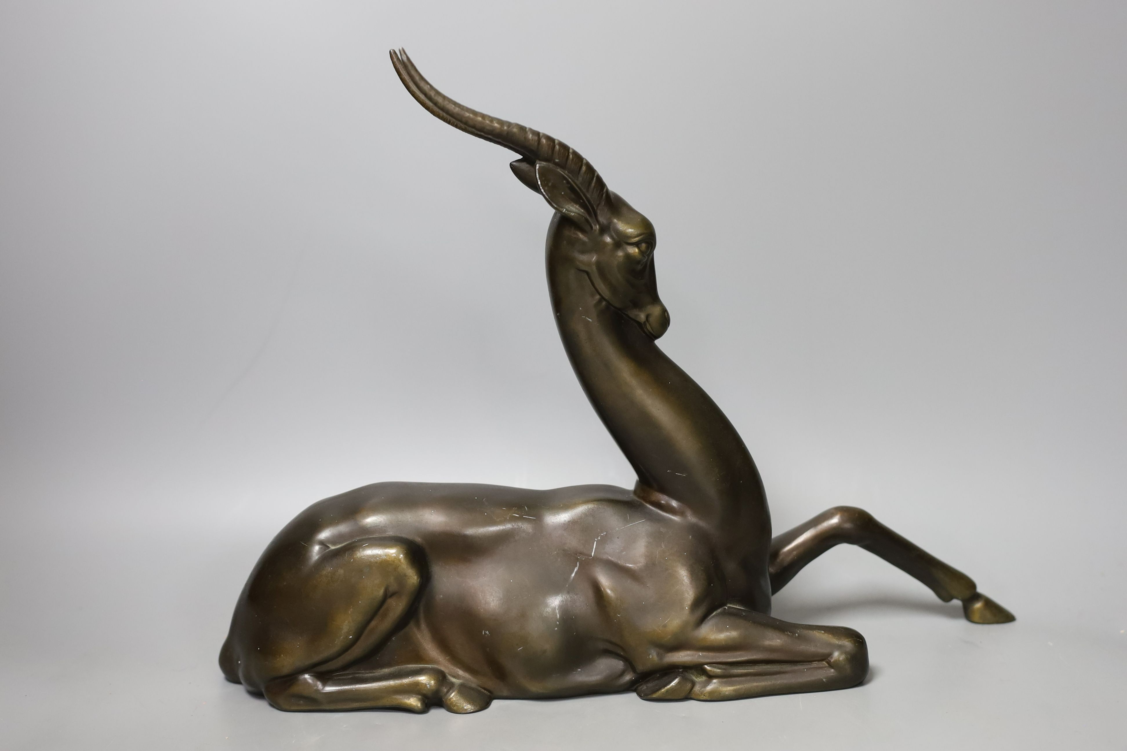 An Art Deco bronze-finished spelter gazelle - 28cm tall